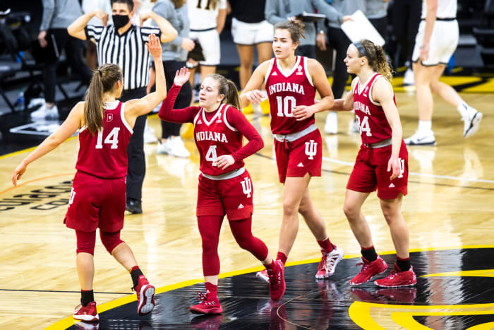 Indiana's Nicole Carda o-Hillary gets a high five from teammate, Ali Patberg.